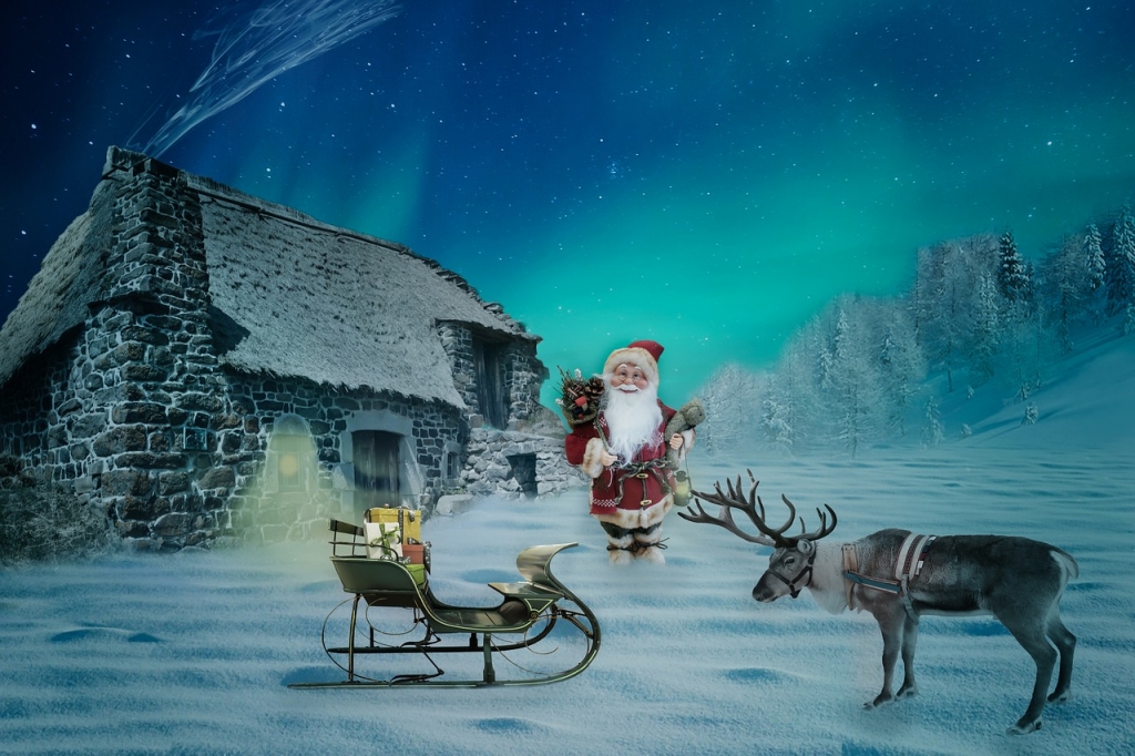 Weihnachtsmann und Rentier mit Kutsche